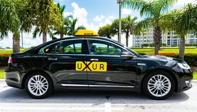 Uxur Taxi car providing long-distance ride share service between Orlando and Miami
